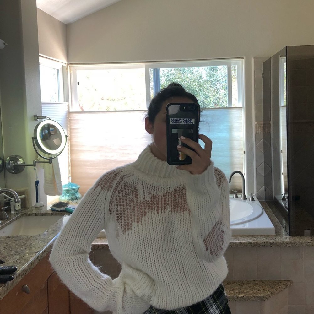 Distressed white mock neck sweater
